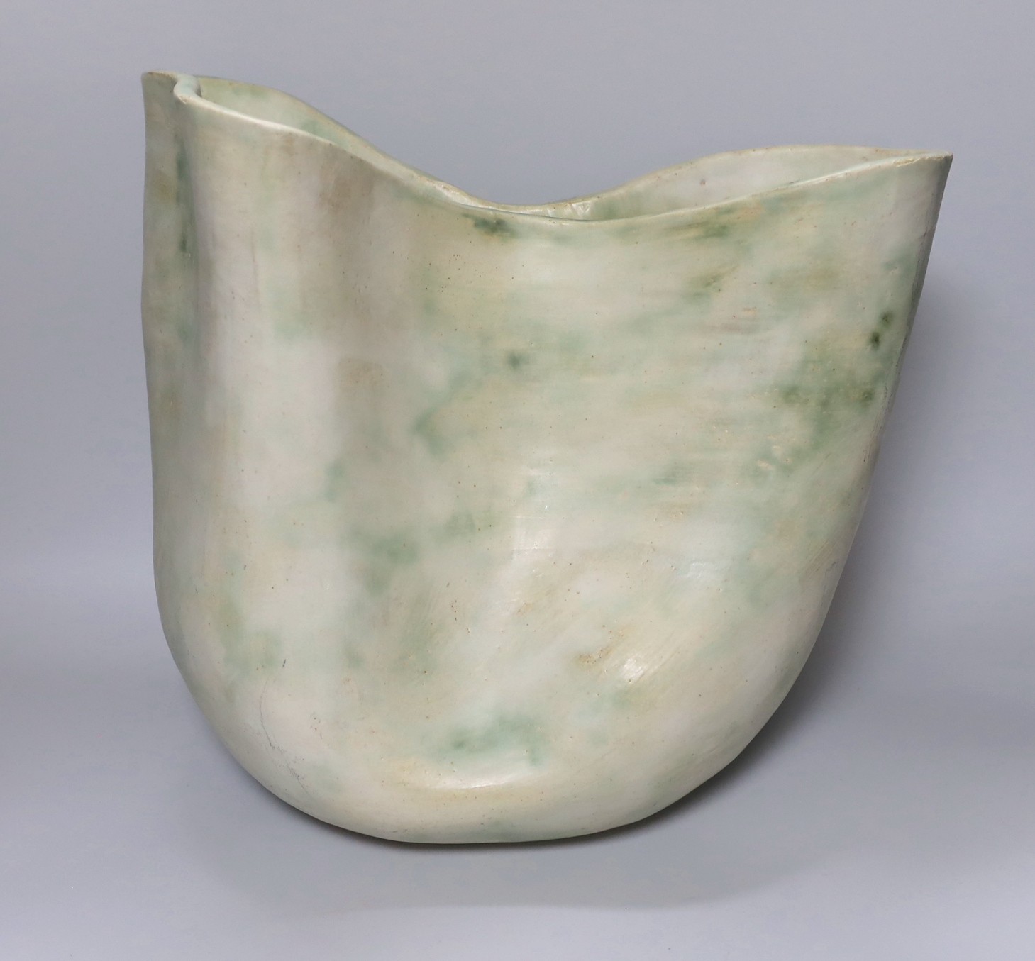 Ruth Sulke - a large studio stoneware white and green glazed free-form vase, 31cm